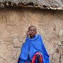 Sinya, Tanzania. Maasi man sitting by his hut
